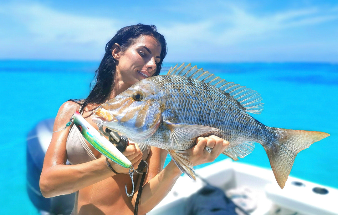 Angler holding a large reef fish caught using the Fishlogica Sirius Virtue FSV-760M rod