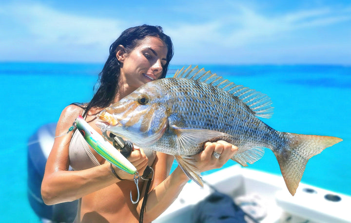 Angler holding a large reef fish caught using the Fishlogica Sirius Virtue FSV-760M rod